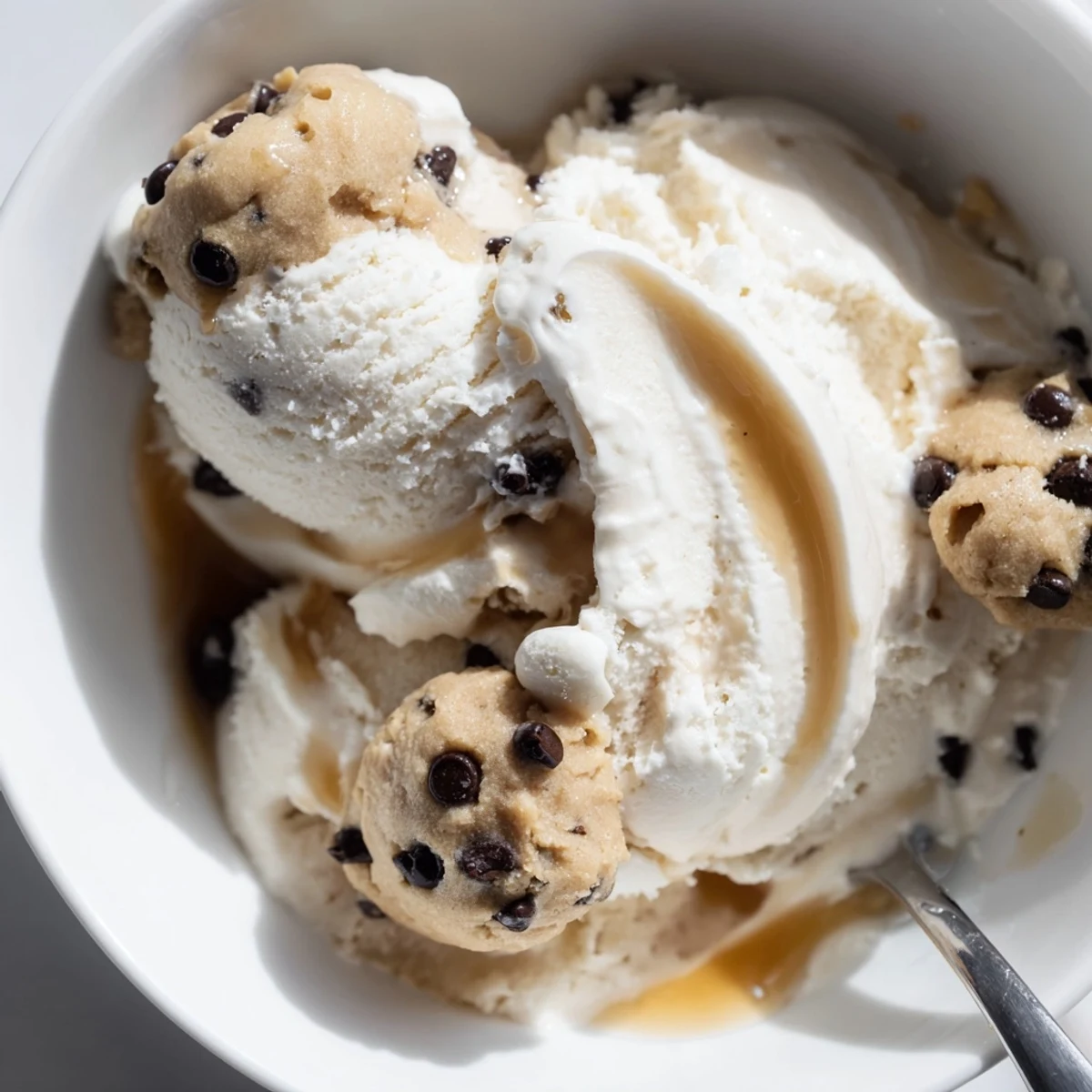 Indulge in this high-protein cottage cheese ice cream topped with cookie dough bites.  