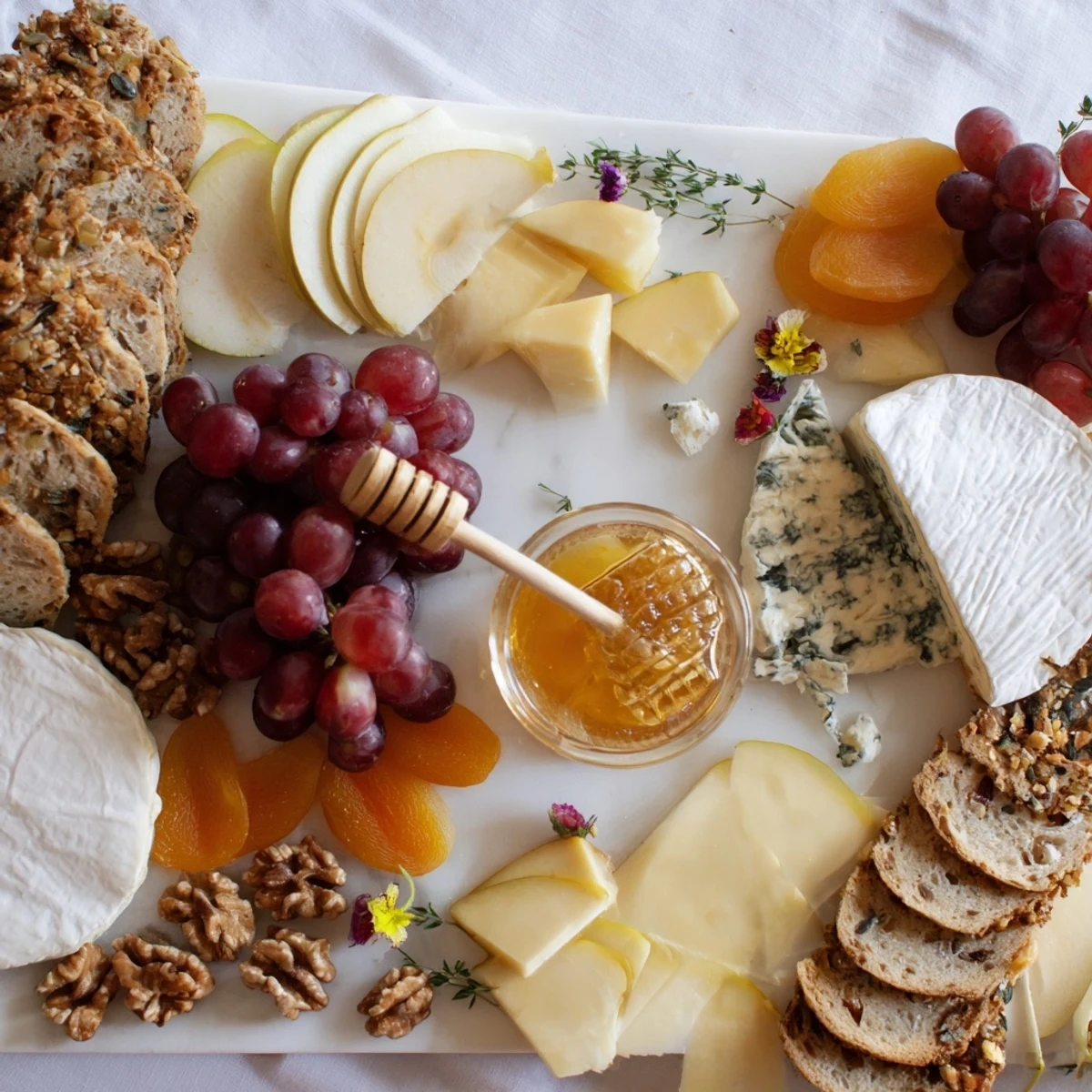 Beautiful arrangement: a Honeycomb, Honey & Cheese Board with a visual medley of flavors and textures.