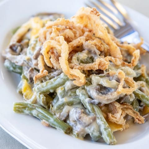 Nostalgic old-school green bean casserole, a creamy delight for holiday gatherings.  