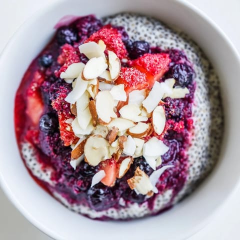 Creamy berry chia pudding layered with vibrant red berries, a healthy and delicious make-ahead breakfast.