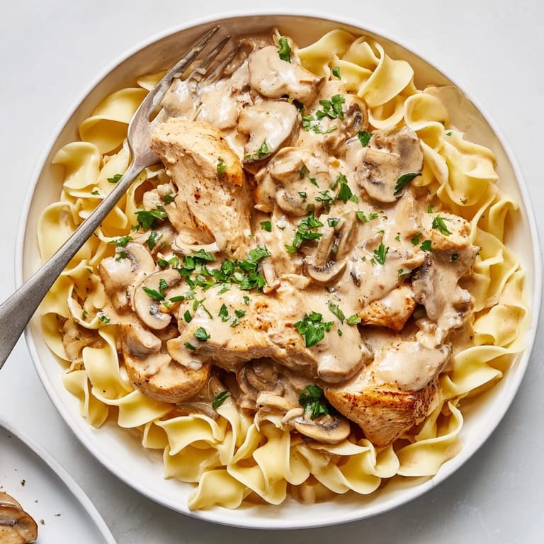 Delicious Creamy Chicken Stroganoff in a savory mushroom sauce, perfect for weeknight dinners.