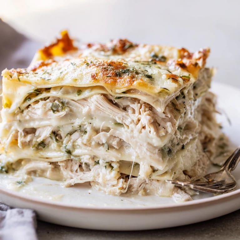 Deliciously fragrant rosemary chicken lasagna, ideal paired with a crisp white wine.