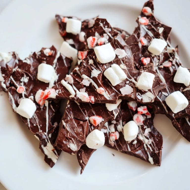 Enjoy a decadent slice of Hot Chocolate Bomb Bark, perfect for melting into rich, creamy hot chocolate drinks.