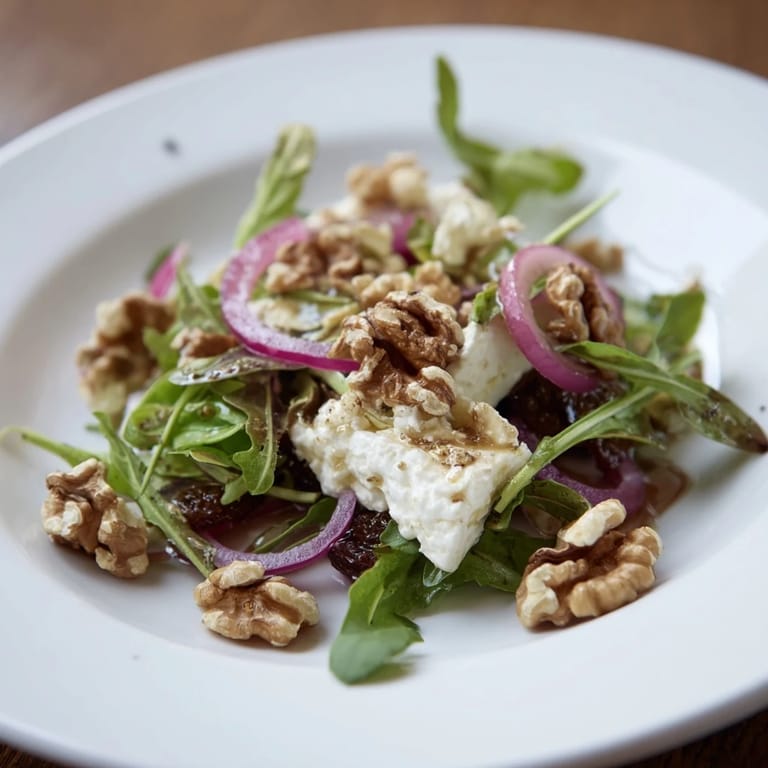 Enjoy this elegant Spiced Honey and Date Goat Cheese Salad made with Medjool dates and toasted walnuts.